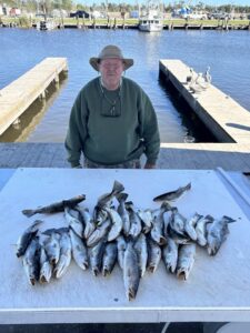 Louisiana fisherman with a limit of speckled trout